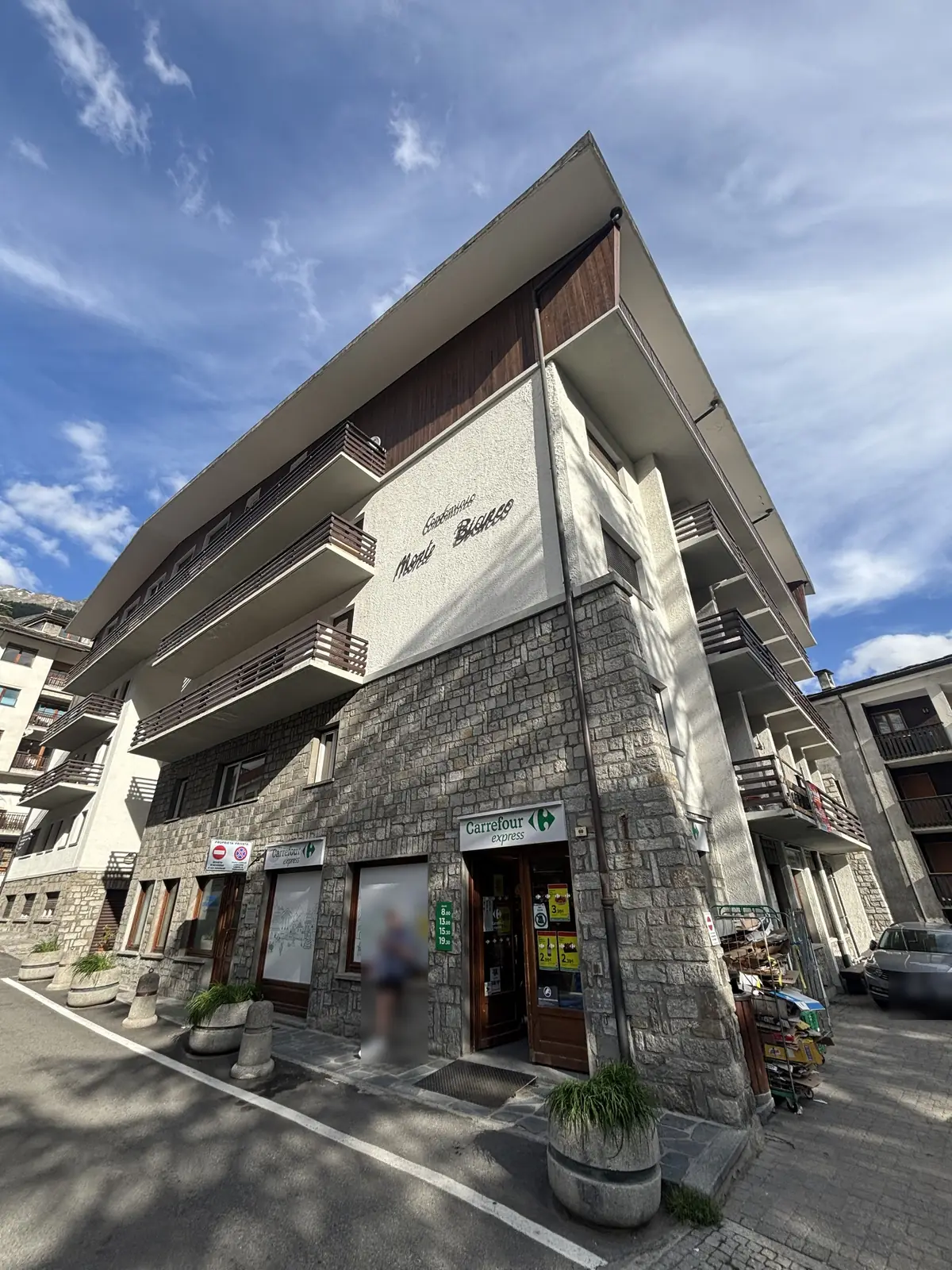 Via Circonvallazione: the building with the Carrefour Express on the ground floor.